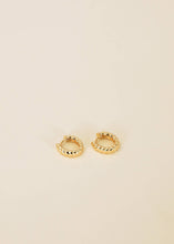 Load image into Gallery viewer, Gold hoop earrings on a beige background