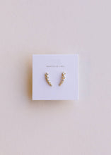 Load image into Gallery viewer, Pair of gold earrings on a Jaxkelly branded card against a light background