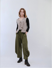 Load image into Gallery viewer, Woman wearing a beige vest and pants set against a white background