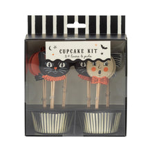 Load image into Gallery viewer, A Halloween-themed cupcake kit in its retail packaging, featuring two decorated wooden cake toppers and two striped cupcake liners inside a clear plastic box with a black and white striped header.