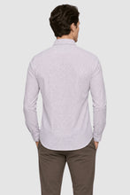 Load image into Gallery viewer, A man viewed from the back wearing a light lavender long-sleeve button-down shirt with a fine micro-pattern, paired with brown trousers, against a solid light gray background.